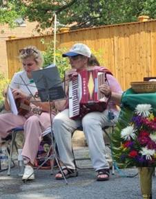 Erica on the violin & Jan on the accordian_Outdoor Worship '25.jpg